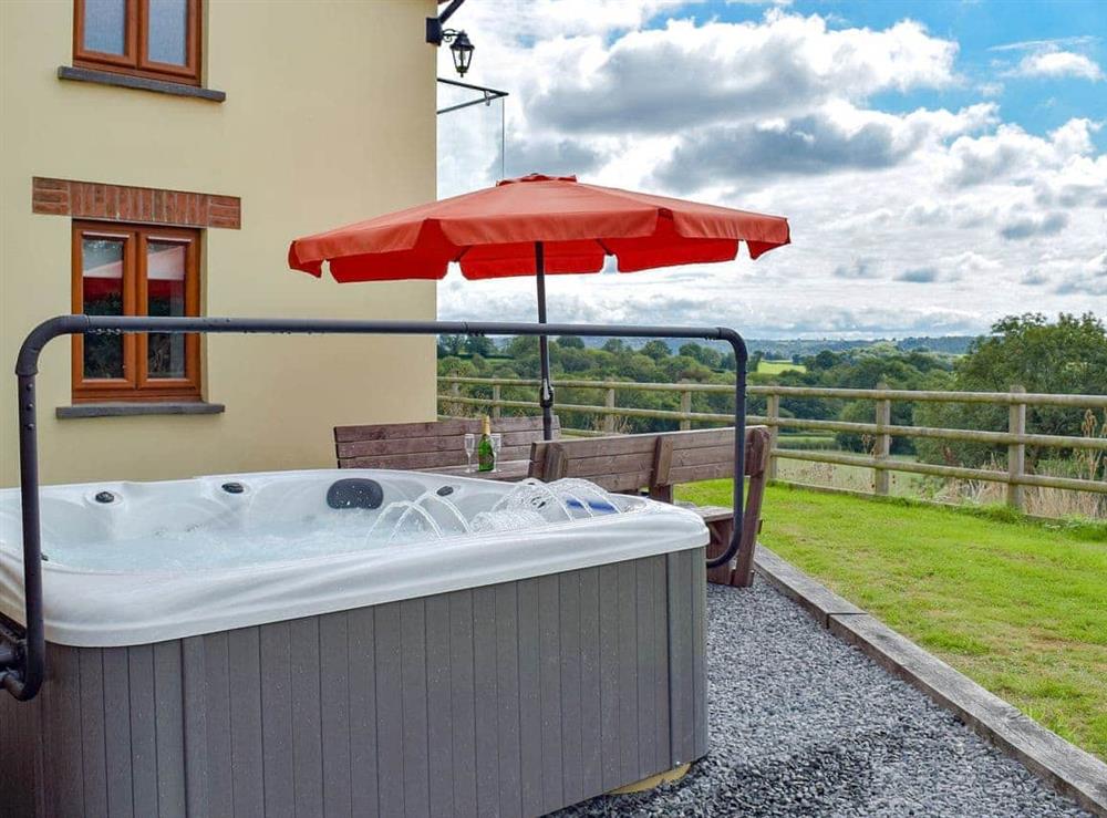 Relaxing hot tub with countryside views at Bwthyn Y Mynach in Nantgaredig, near Carmarthen, Dyfed