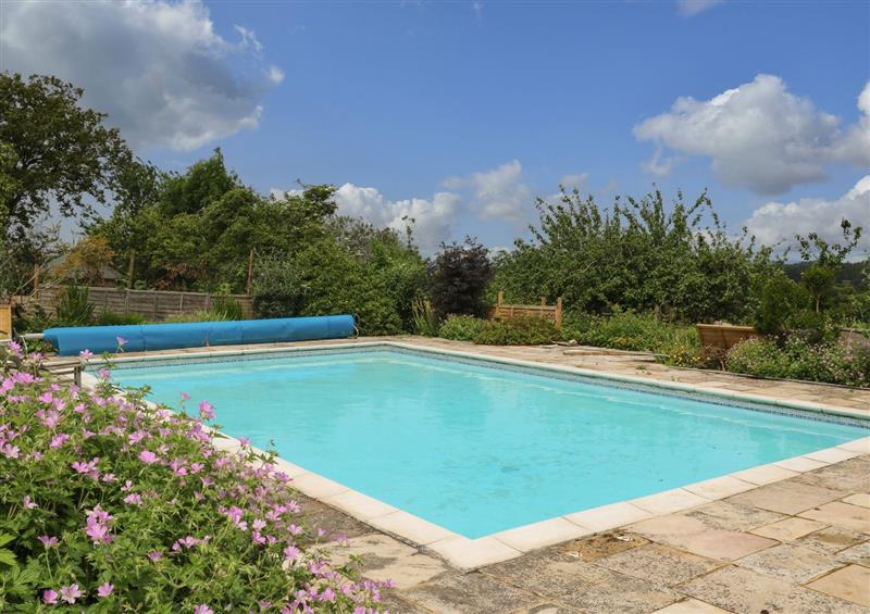 Enjoy the swimming pool at Byre Cottage 4, Sullington near Storrington