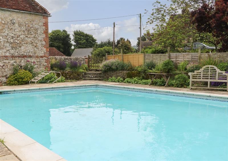 There is a swimming pool at Byre Cottage 4, Sullington near Storrington