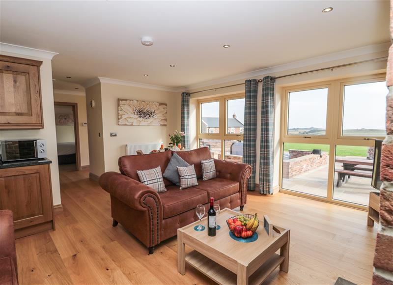 Enjoy the living room at Byre Cottage, Embleton