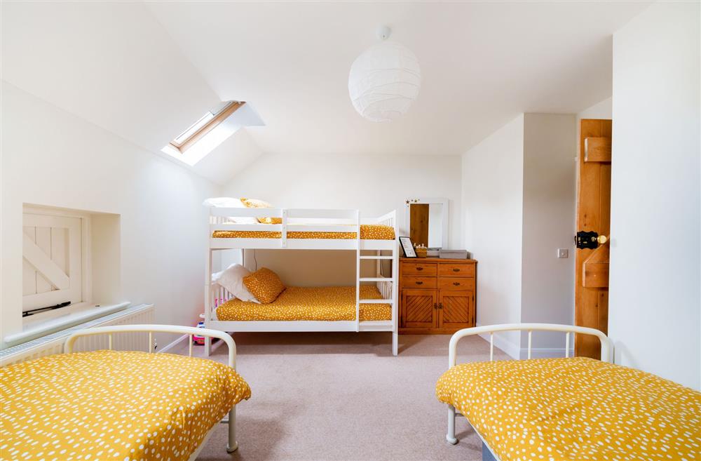Bedroom three with 3’ twin single beds and full-size bunk beds (suitable for children) (photo 2) at Byre House, Blandford