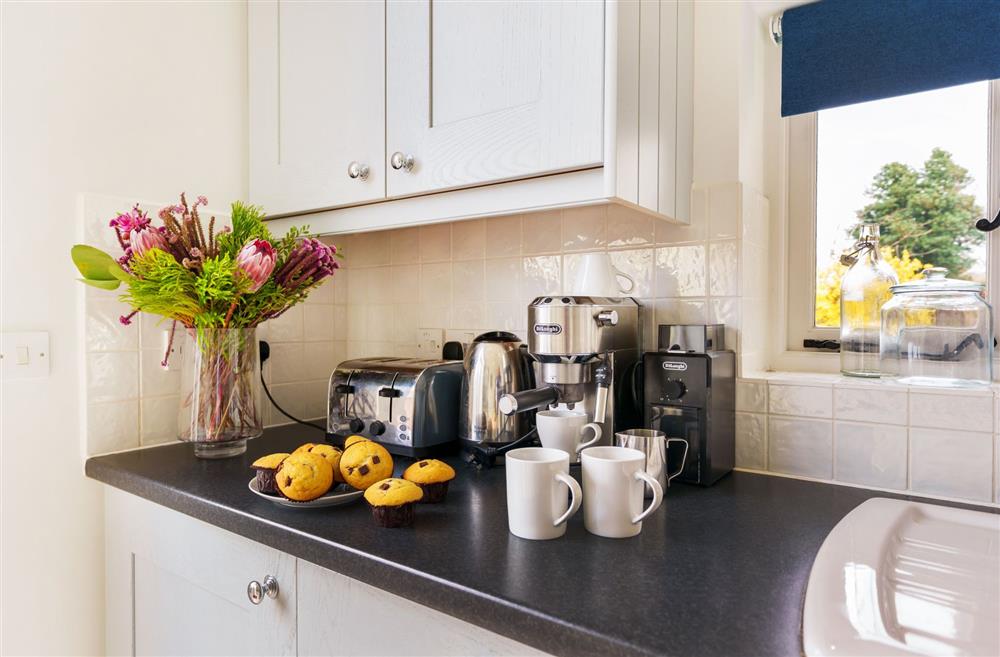 The kitchen is well-equipped and includes a small coffee machine at Byre House, Blandford