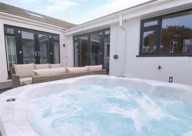 Spend some time in the hot tub at Byrons Retreat, Crantock