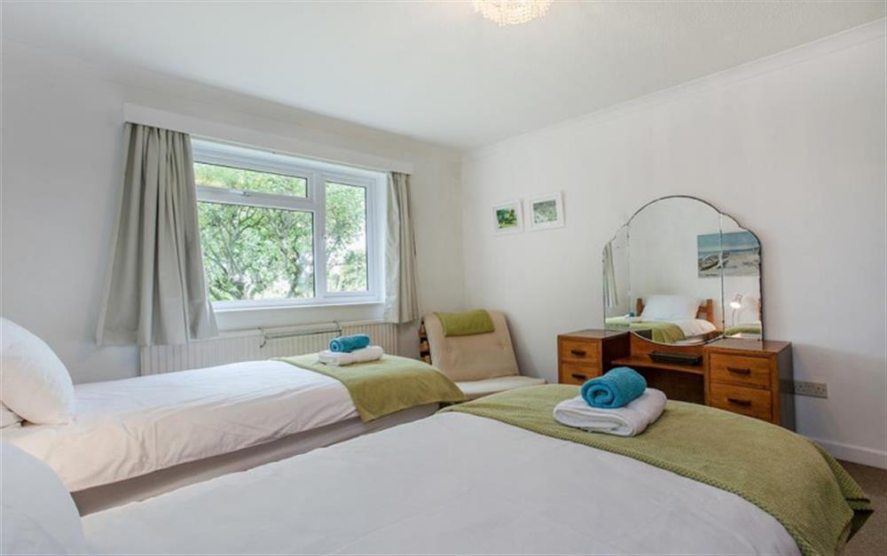 Another view of the twin bedroom with views over the garden. at Bywater in Torcross