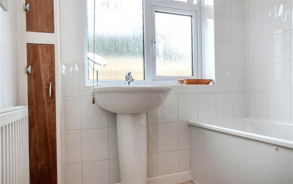 The family bathroom, with shower over the bath. at Bywater in Torcross