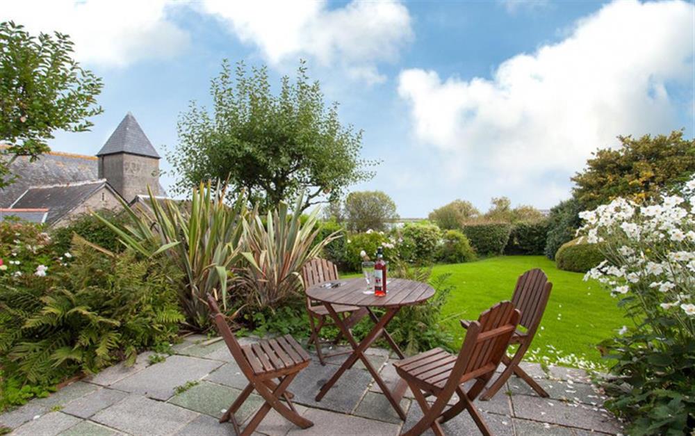 The sunny patio and garden with views over the ley. at Bywater in Torcross