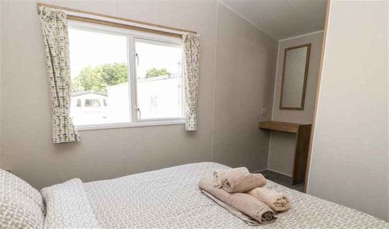 A bedroom in C22 Par Sands at C22 Par Sands, Par