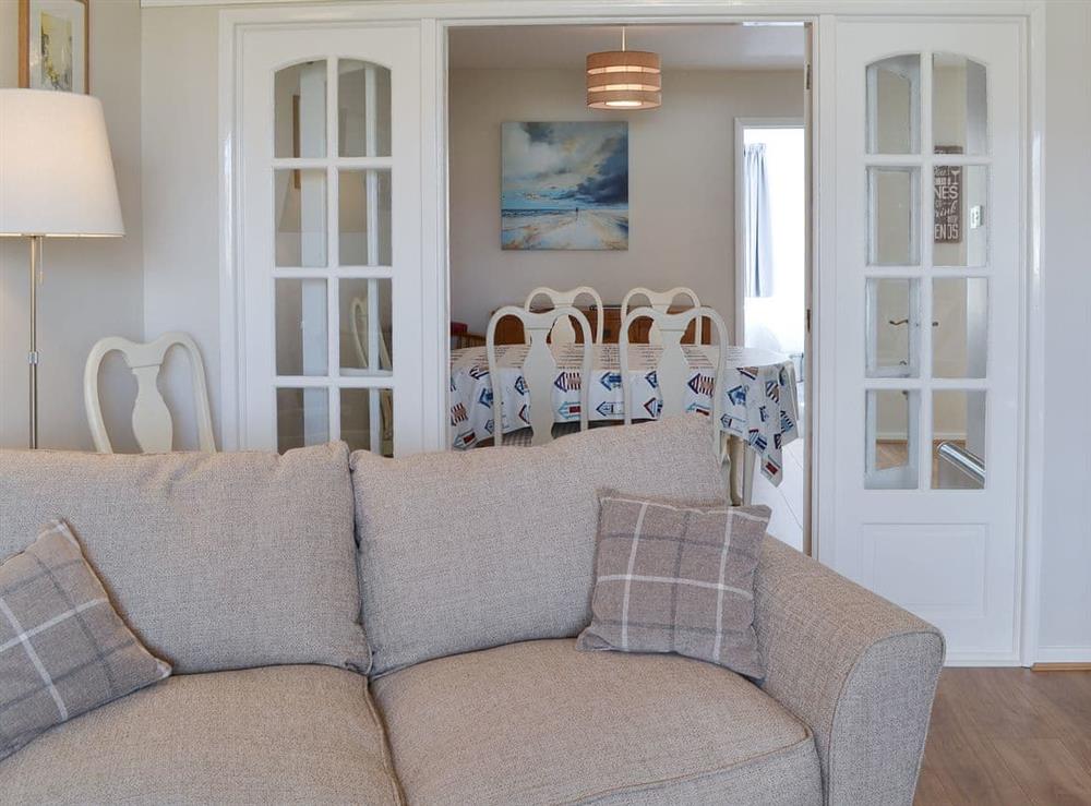 Living area and through-dining area at Cabbage Tree Cottage in Beadnell, near Alnwick, Northumberland