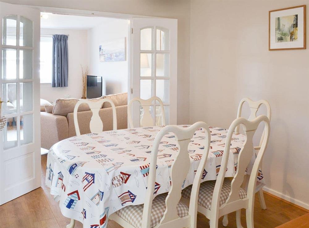 Stylish dining table and chairs at Cabbage Tree Cottage in Beadnell, near Alnwick, Northumberland