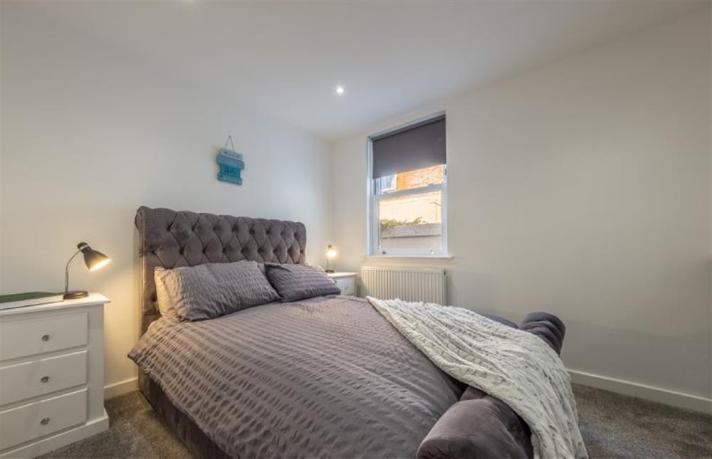 Ground floor: Master bedroom with a double bed at Cabbell Courtyard, Cromer