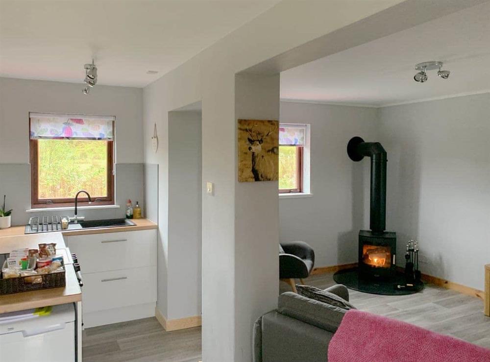 Open plan living space at Caberfeidh Cottage in Spean Bridge, Inverness-Shire