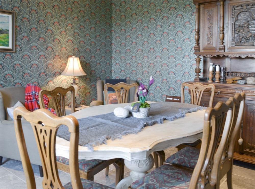 Elegant dining room with seating area at Caberfeidh in North Tolsta, near Stornoway, Isle of Lewis, Outer Hebrides, Scotland