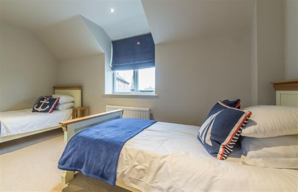 First floor: Bedroom four with twin beds at Caddows, Docking near Kings Lynn