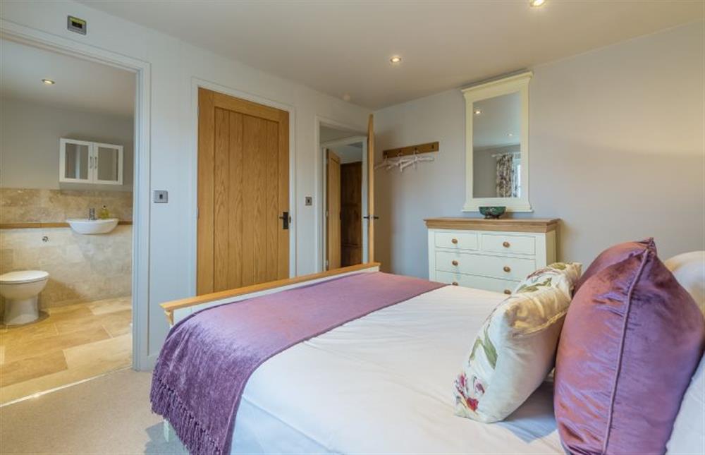 First floor: Master bedroom with en-suite shower room at Caddows, Docking near Kings Lynn