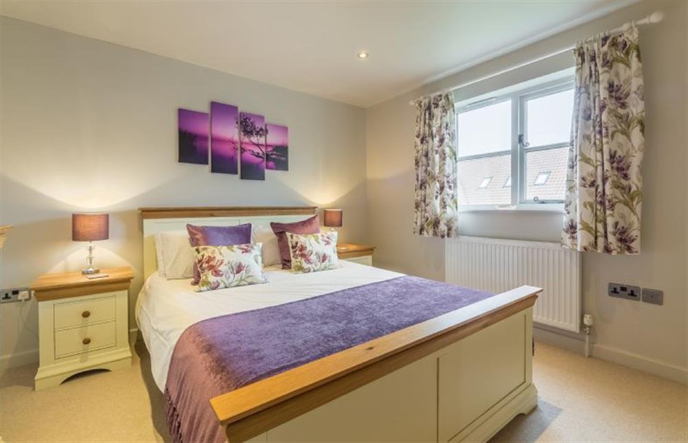 First floor: Master bedroom with King-size bed at Caddows, Docking near Kings Lynn