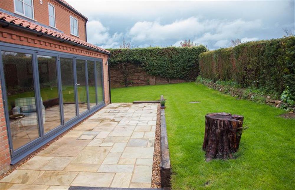 Fully enclosed garden with terrace area at Caddows, Docking near Kings Lynn