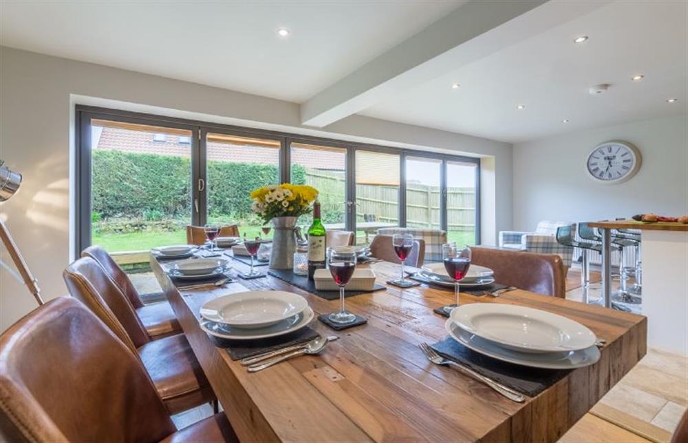 Ground floor: Dining table with seating for eight at Caddows, Docking near Kings Lynn