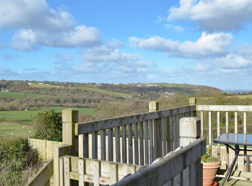 Decking area with views of the beautiful countryside at Cae Gwyrdd in Cardigan, Dyfed