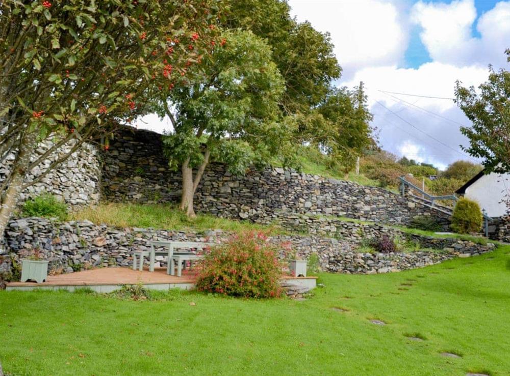 Large lawned garden with decked area at Caefadog Fach in Barmouth, Gwynedd., Great Britain
