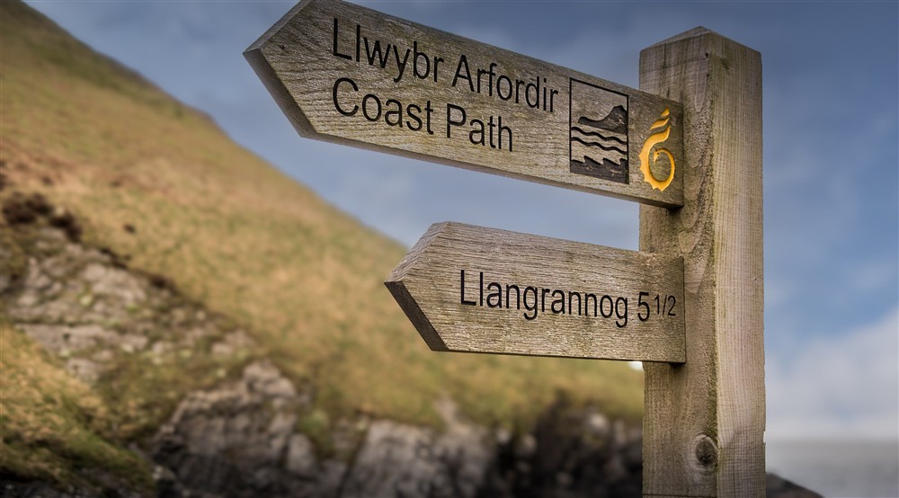 Signs for the coast path near Caerllan, Ceredigion at Caerllan in Llandysul, Ceredigion
