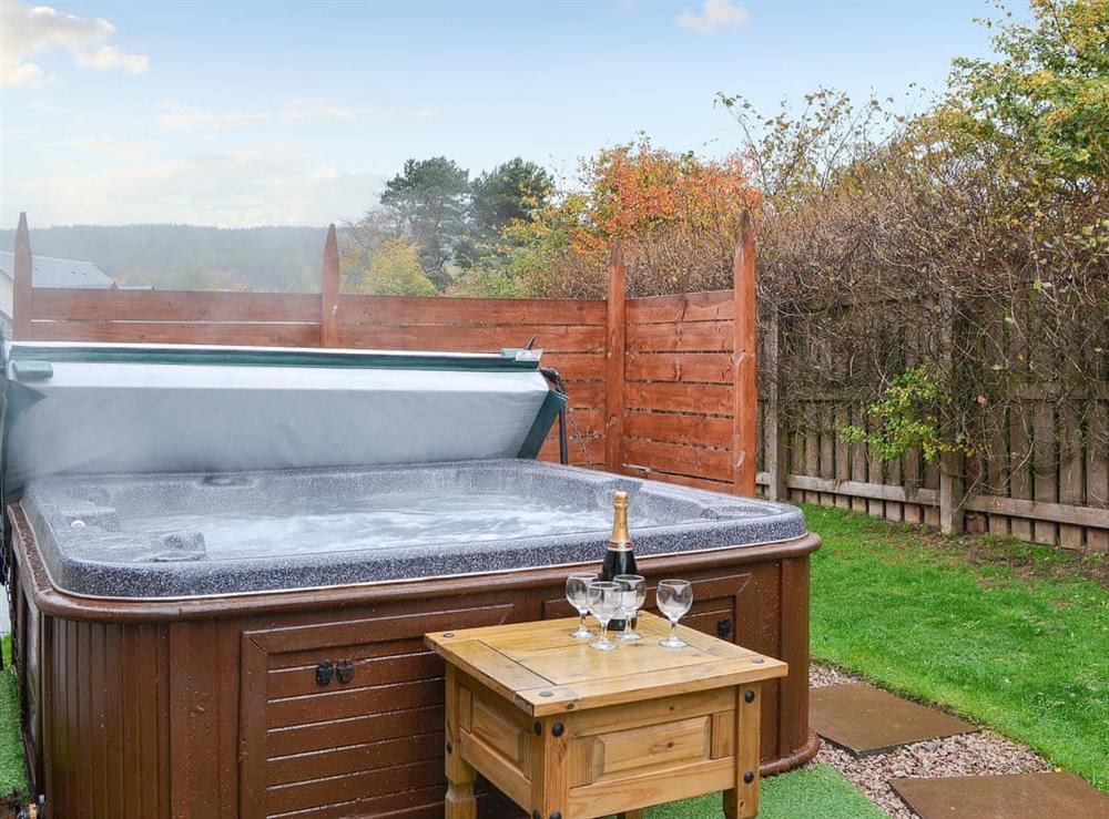 Relax in the lovely hot tub at Cairn View in Aviemore, Inverness-Shire