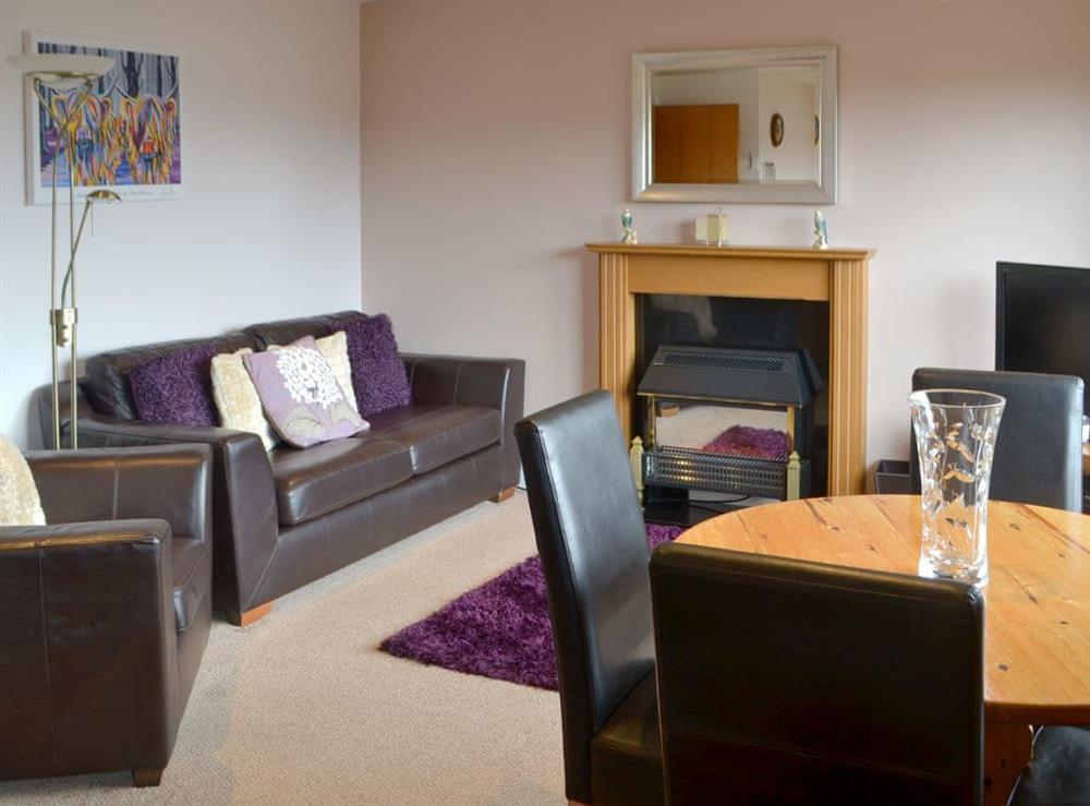 Comfy living/ dining room at Assynt Chalet, 