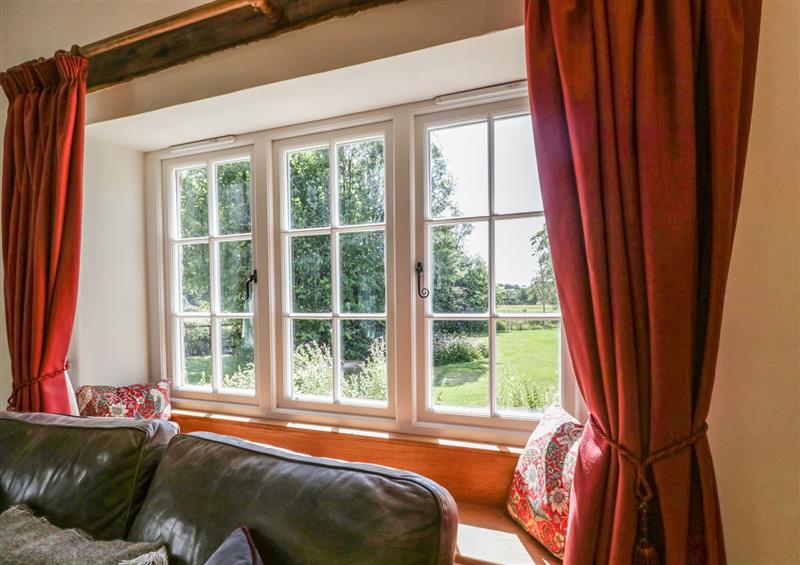Relax in the living area at Caldhu Cottage, Holmrook