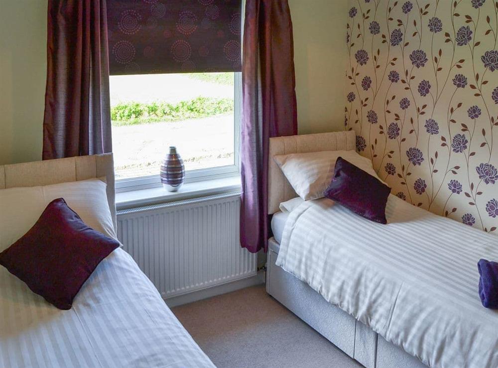 Bedroom boasting twin single beds at California Halt in California, near Great Yarmouth, Norfolk