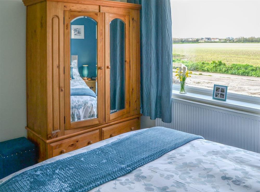 Charming bedroom with delightful view at California Halt in California, near Great Yarmouth, Norfolk