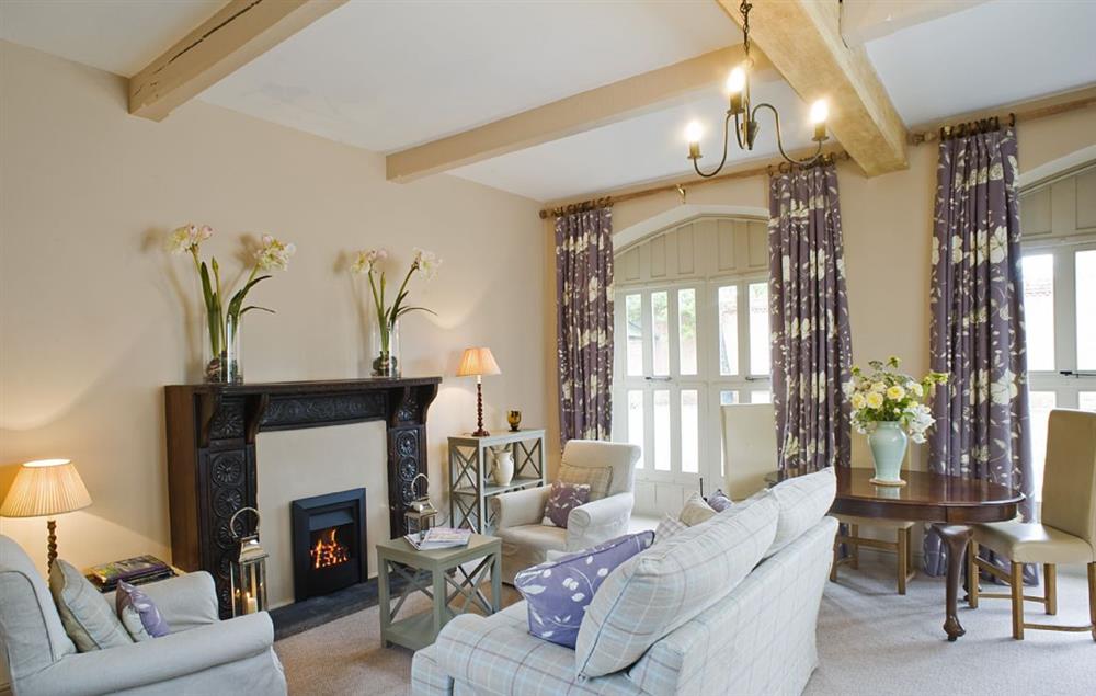 The cottage has an impressive carved fireplace which surrounds a gas fire at Callander Cottage, Whitchurch