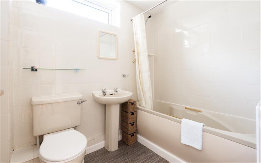 Family bathroom with shower over the bath at Calleva in Lyme Regis