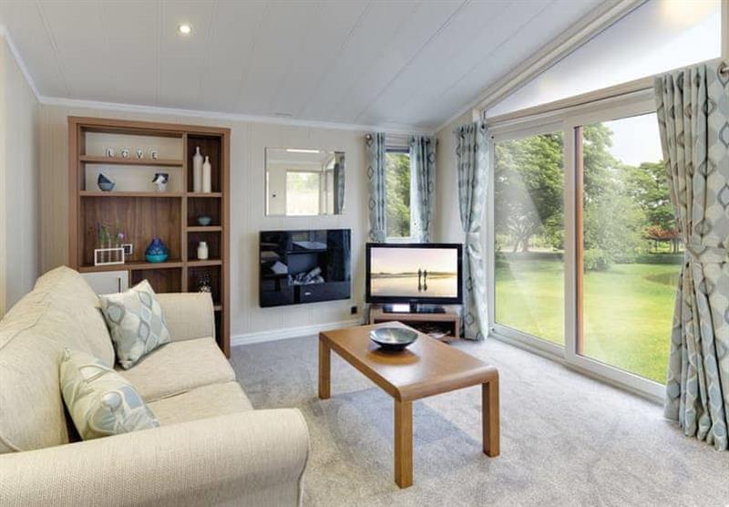 Living room in a Polperro 2 VIP at Calloose Holiday Park in Leedstown, Cornwall