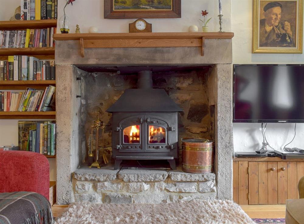 Warm and cosy multi-fuel burner at Cam Cottage in Kettlewell, near Grassington, Yorkshire, North Yorkshire