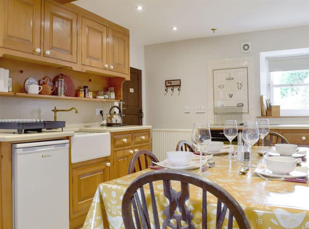 Well equipped kitchen/ dining room at Cam Cottage in Kettlewell, near Grassington, Yorkshire, North Yorkshire