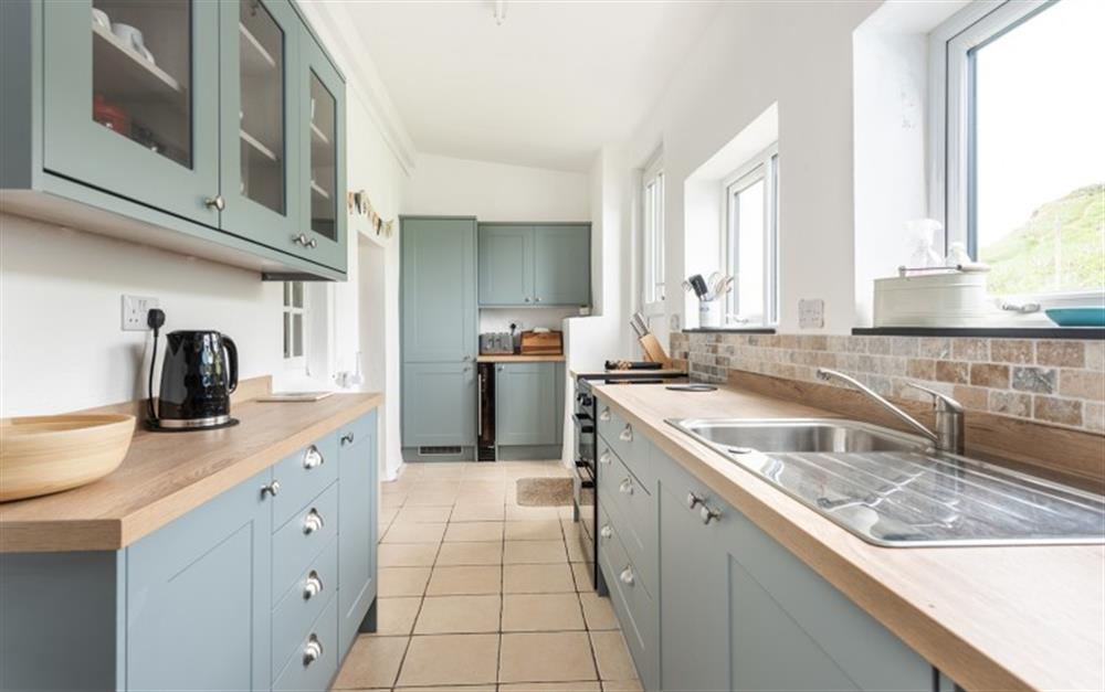 The long and bright kitchen at Camac Cottage in Hope Cove