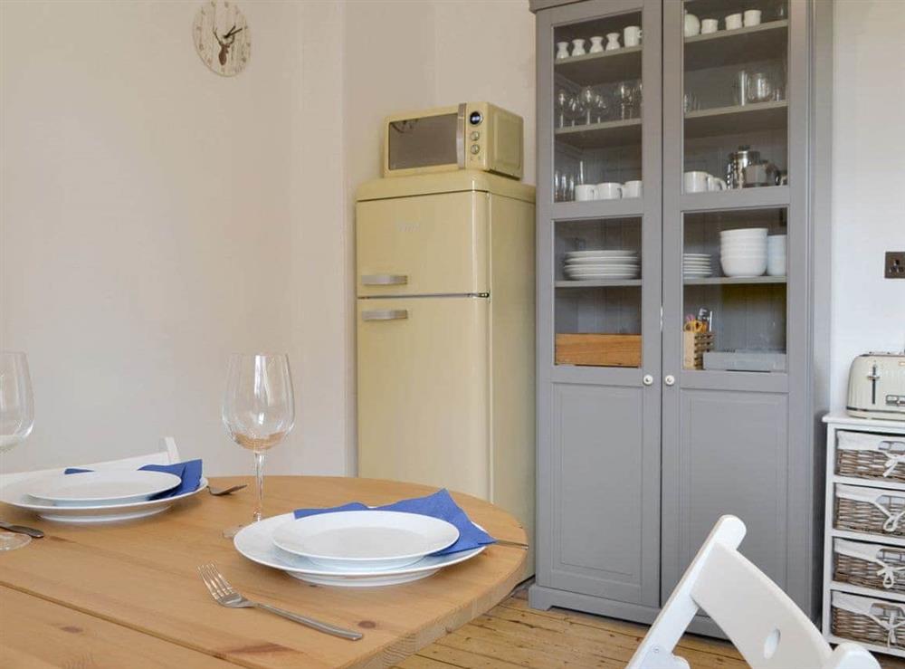 Well-equipped kitchen with dining space at Caman House, Apartment 2 in Newtonmore, Inverness-Shire