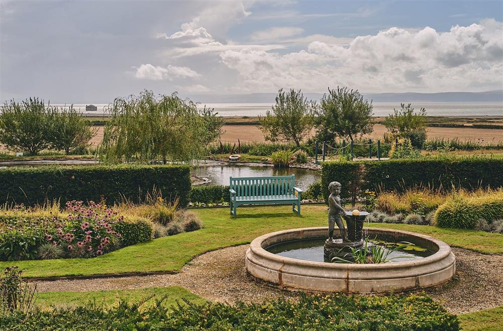 A water fountain and a bench