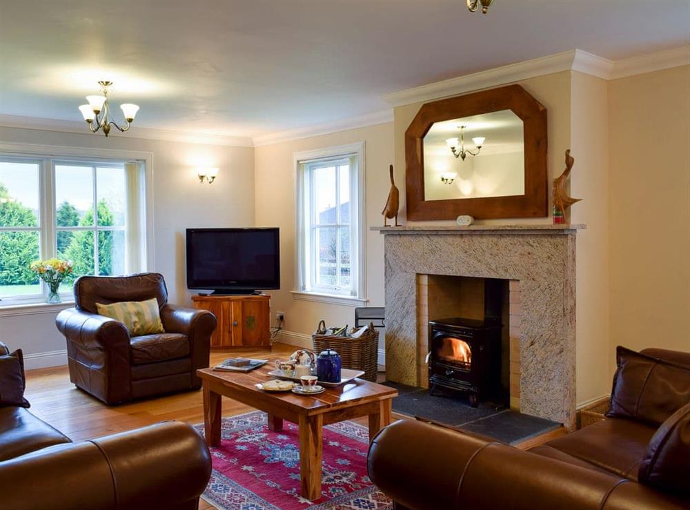 Comfortable living room with wood burner at Cambushinnie Croft in Cromlix, near Dunblane, Perthshire