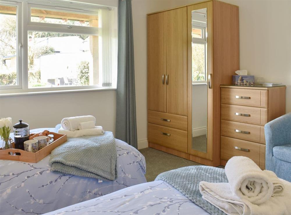 Good-sized twin bedroom at Camelia Cottage in Polmassick, near St Austell, Cornwall, England