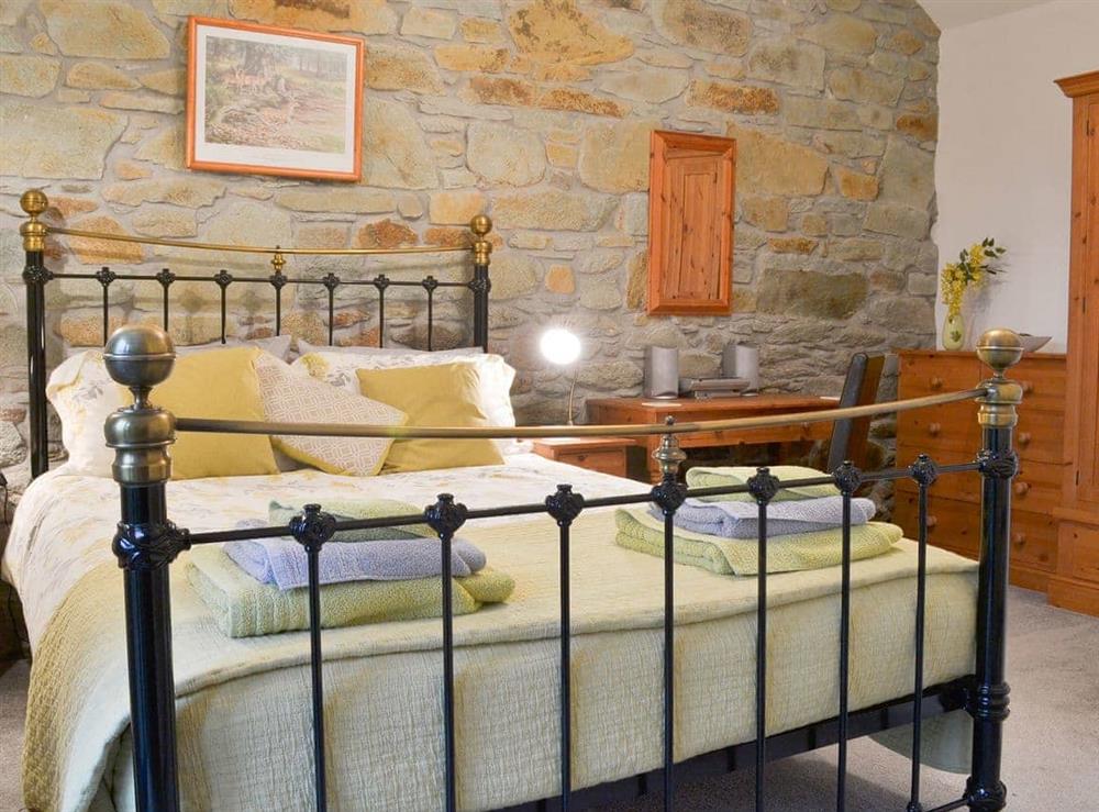 Welcoming double bedded room with French doors to the garden at Campion Cottage in Michaelstow, Nr Camelford, Cornwall., Great Britain
