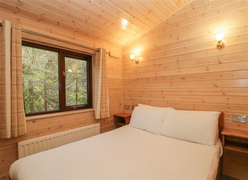 This is a bedroom at Canadian Cabin No 38, Keswick