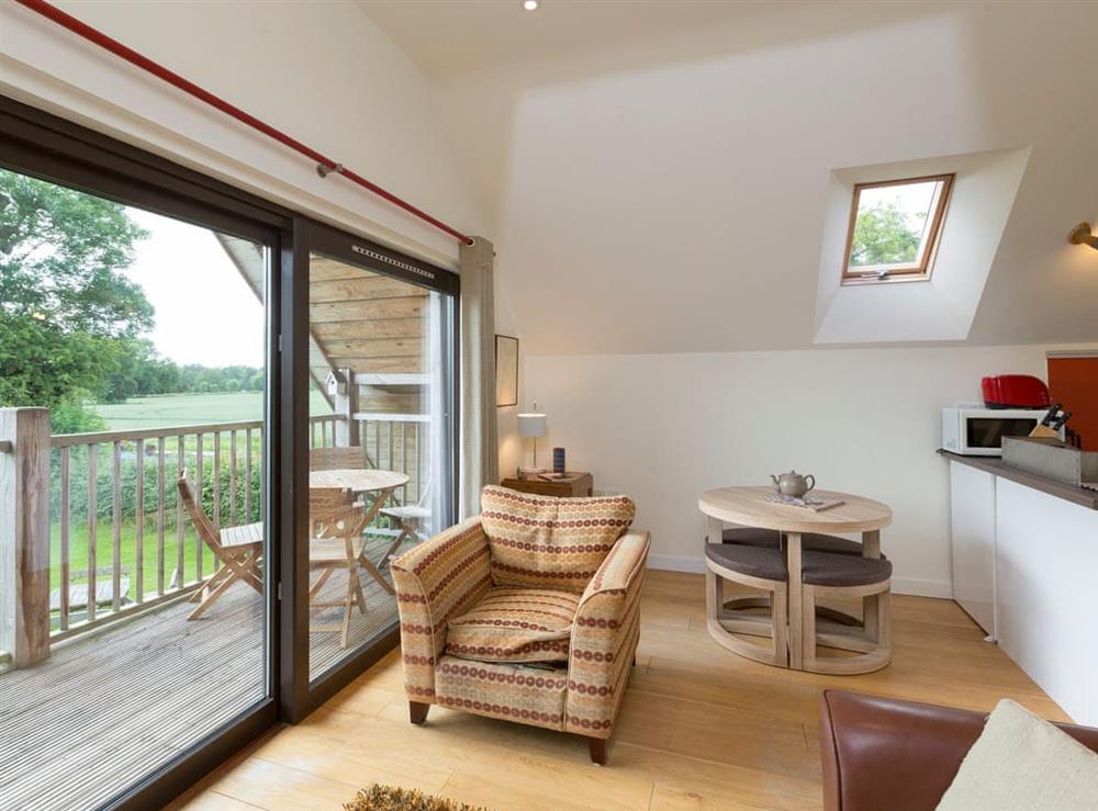 Cosy living area of open-plan room at Canal Central in Maesbury Marsh, near Oswestry, Shropshire