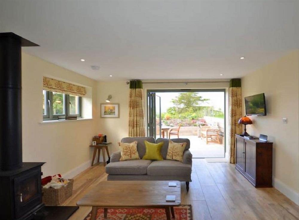 Relax in the living area at Candle Cottage in Arundel, West Sussex