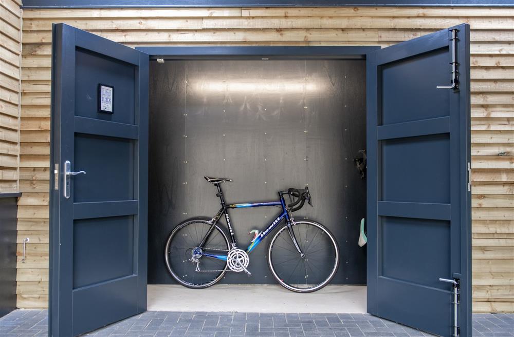 Lockable bike store with power point