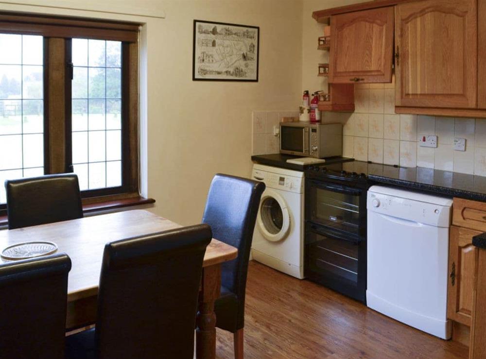 Modest kitchen with breakfast area at Canon Court Farmhouse in Milborne Port, near Sherborne, Dorset