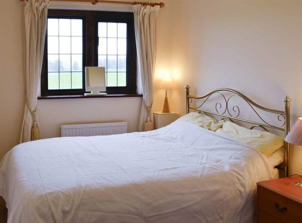 Romantic and inviting bedroom at Canon Court Farmhouse in Milborne Port, near Sherborne, Dorset