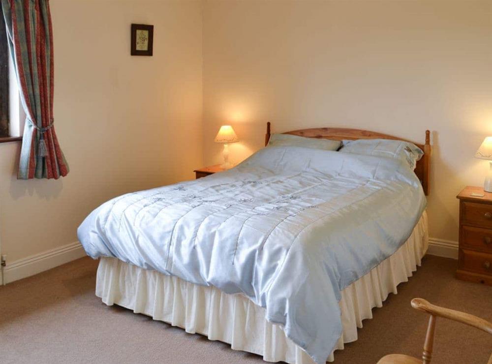 Warm and welcoming double bedroom at Canon Court Farmhouse in Milborne Port, near Sherborne, Dorset