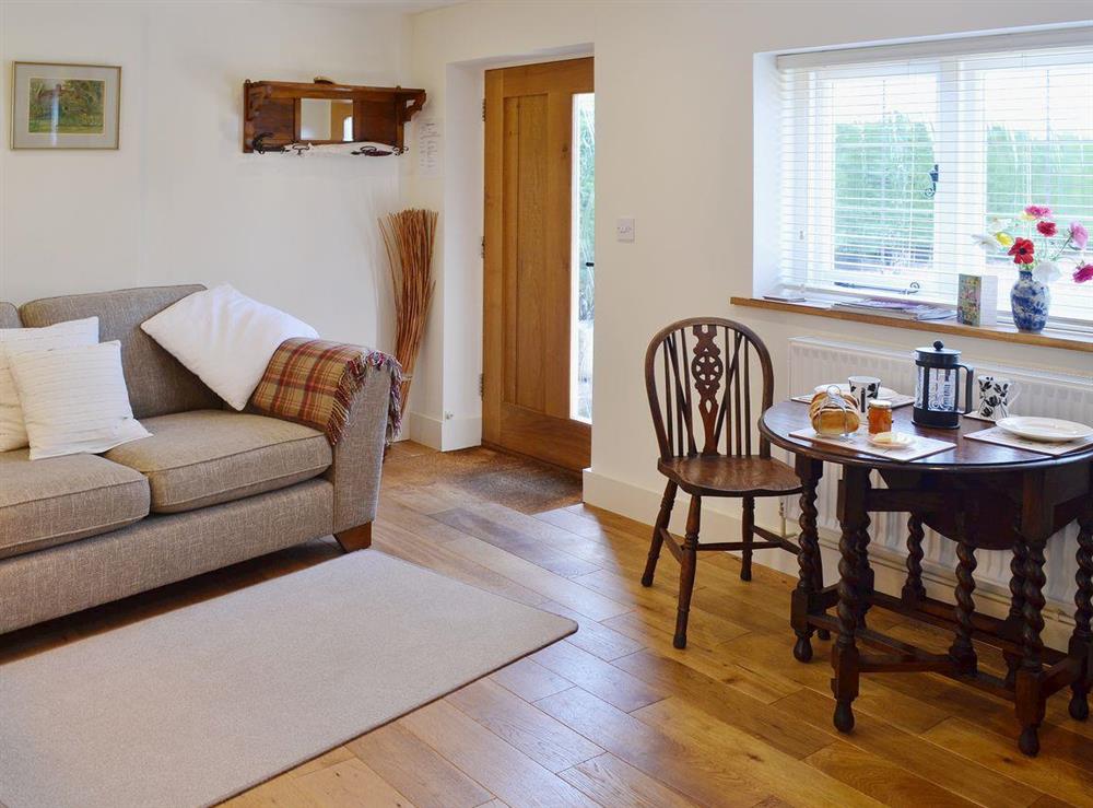 Traditional sits alongside contemporary in the living/dining room at The Gardeners Cottage, 