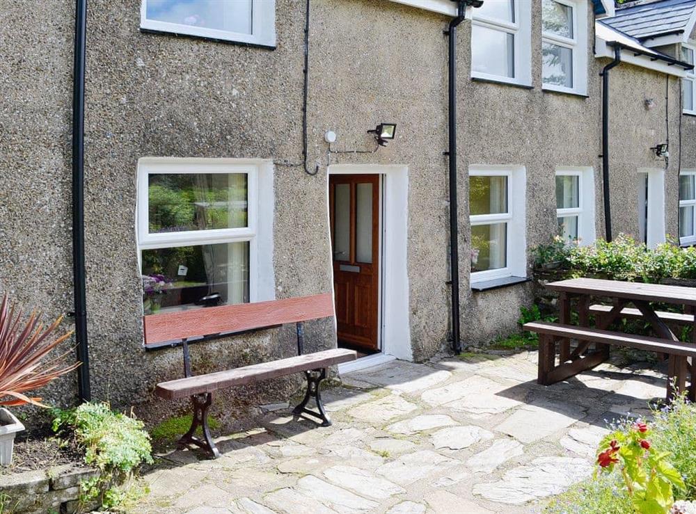 Private patio area at front of cottage at Capel Fawnog Bach in Talsarnau, Gwynedd