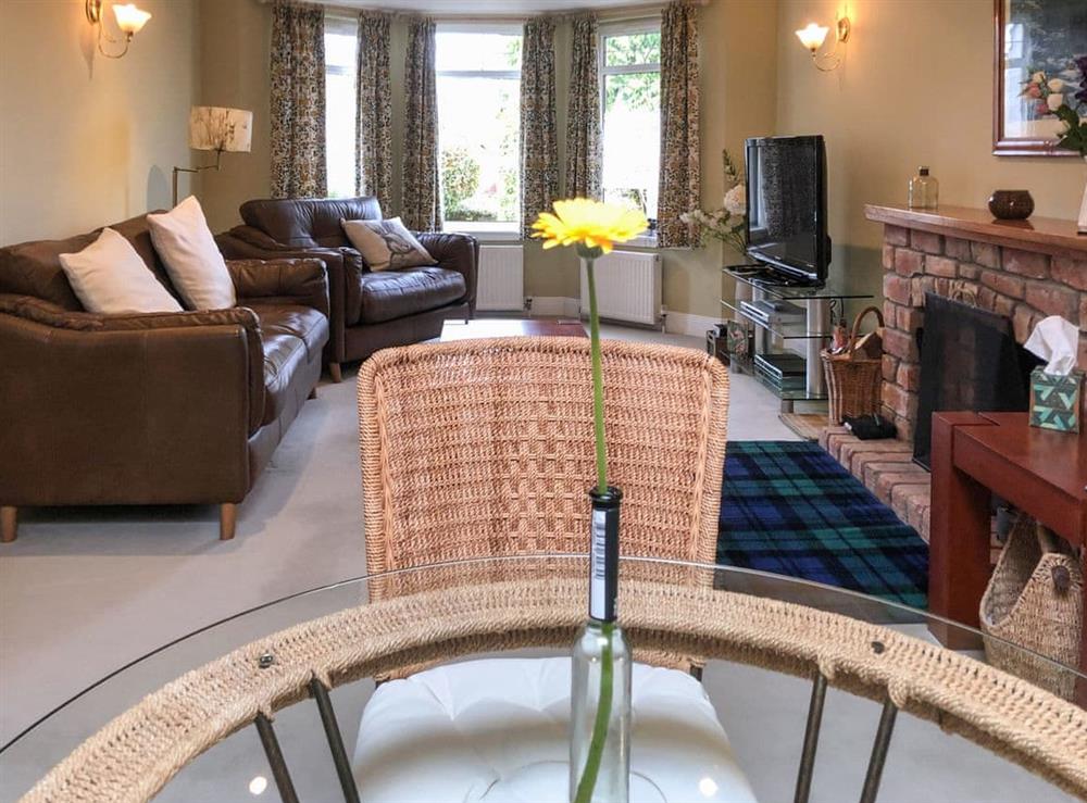 Living room/dining room at Capelrig Cottage in Glasgow, Lanarkshire
